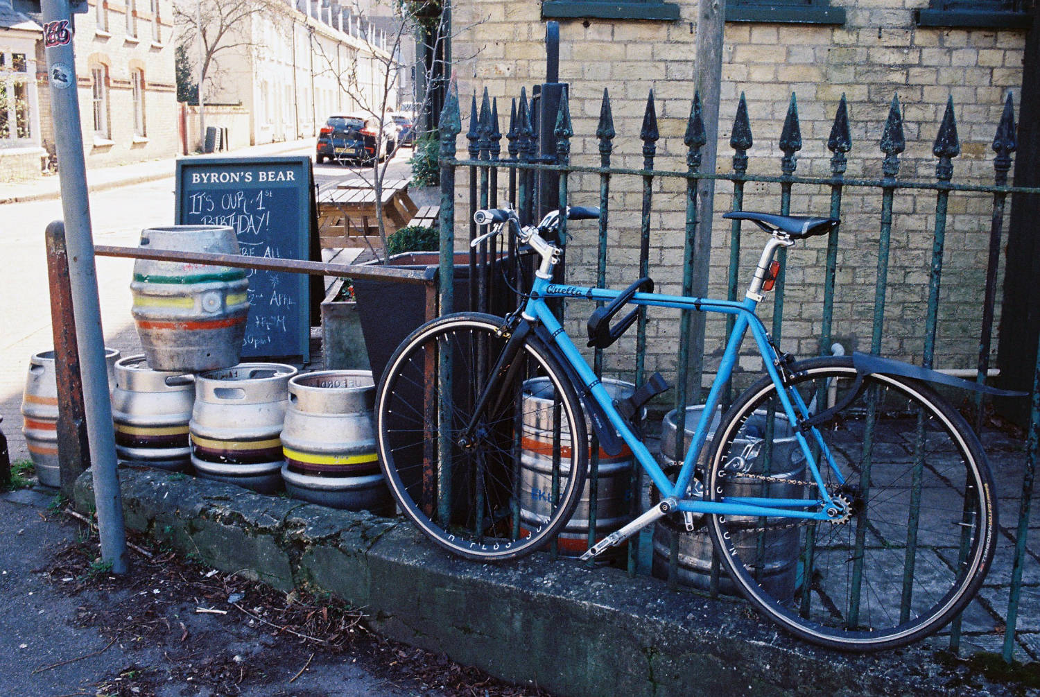 Bike and empty barrels outside The Byron's Bear.