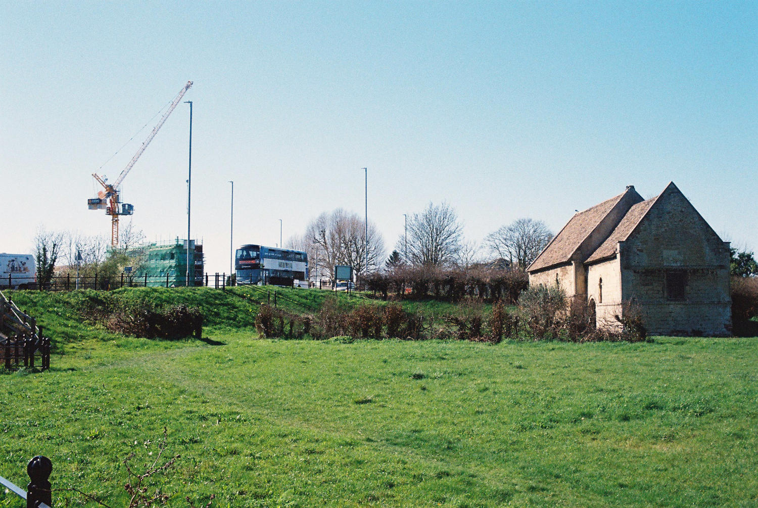 Leper chapel with crane on horizon.
