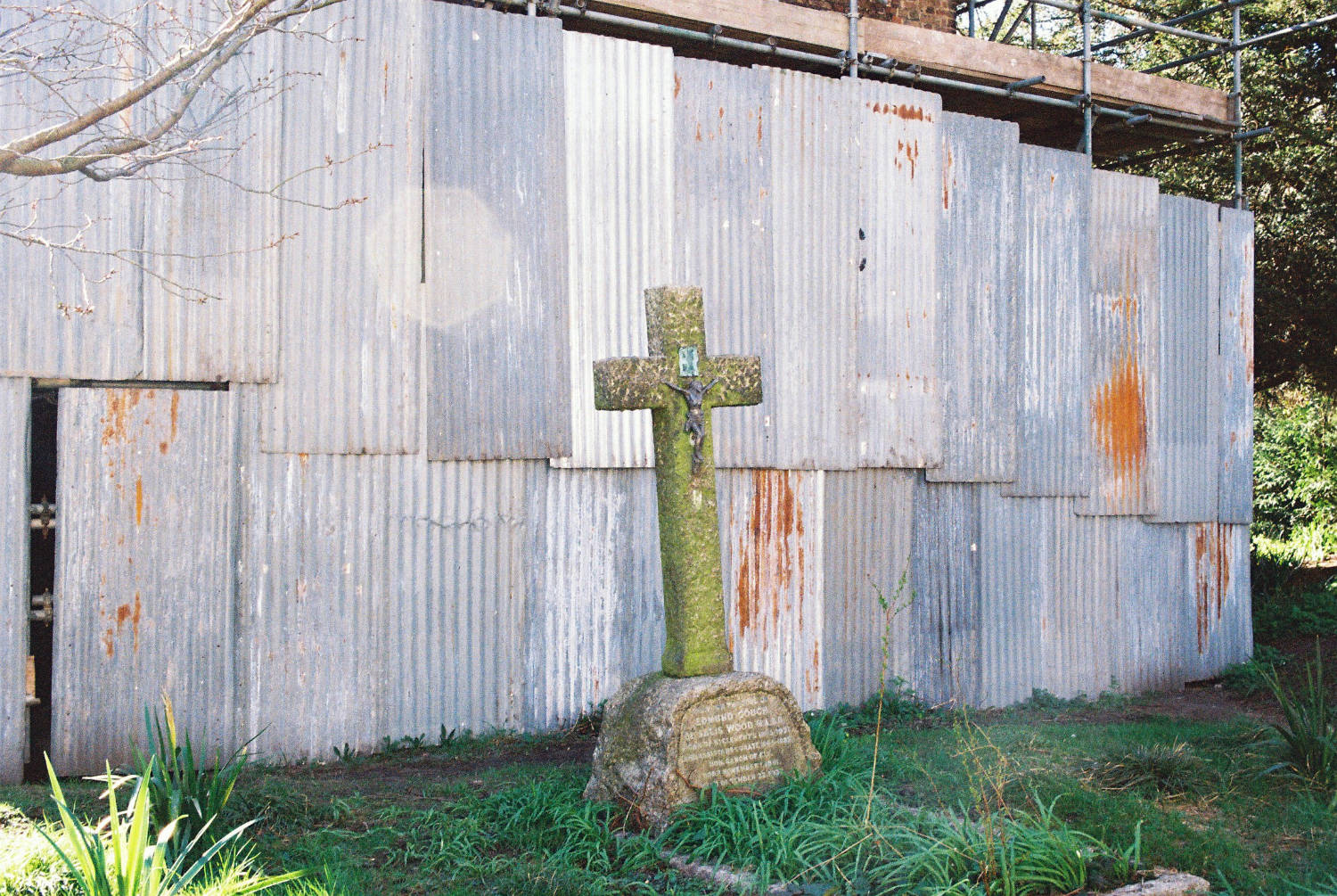Gravestone outside St. Clements church, clad in metal sheeting.